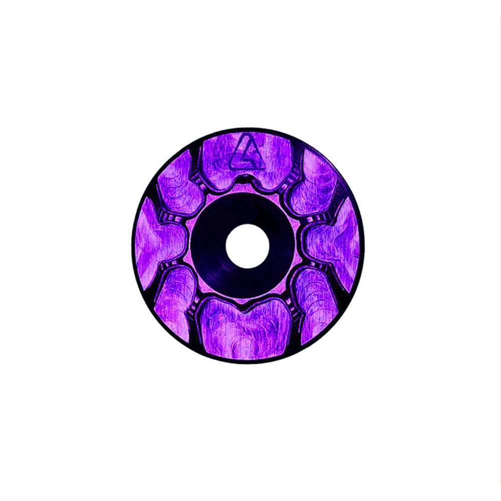 Purple anodized ALUGEAR headset top cap with spider cut-out design, front face view