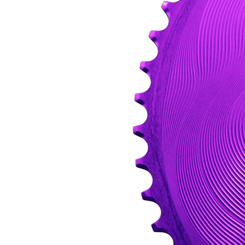 Close-up macro detail of purple anodized ALUGEAR AERO outer GRX chainring teeth and wave-machined surface