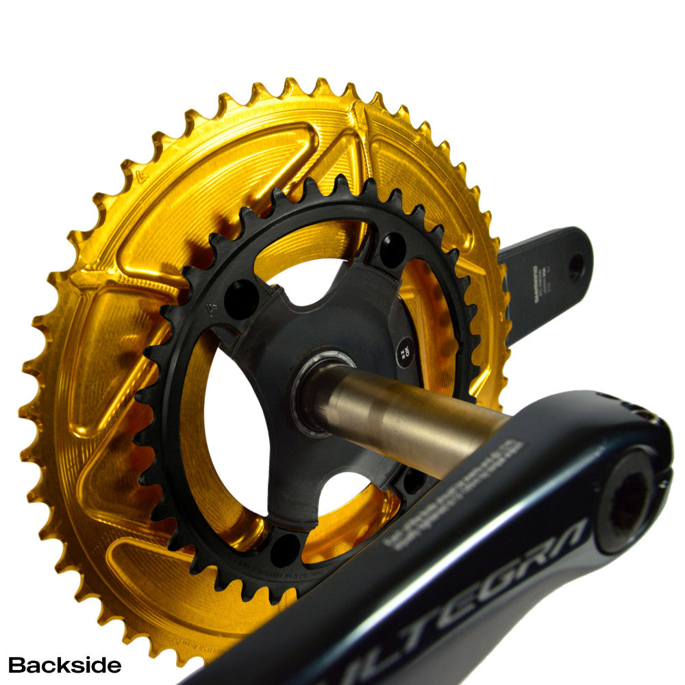 Gold anodized outer and black inner ALUGEAR road chainring set mounted on Shimano Ultegra crankset, backside view