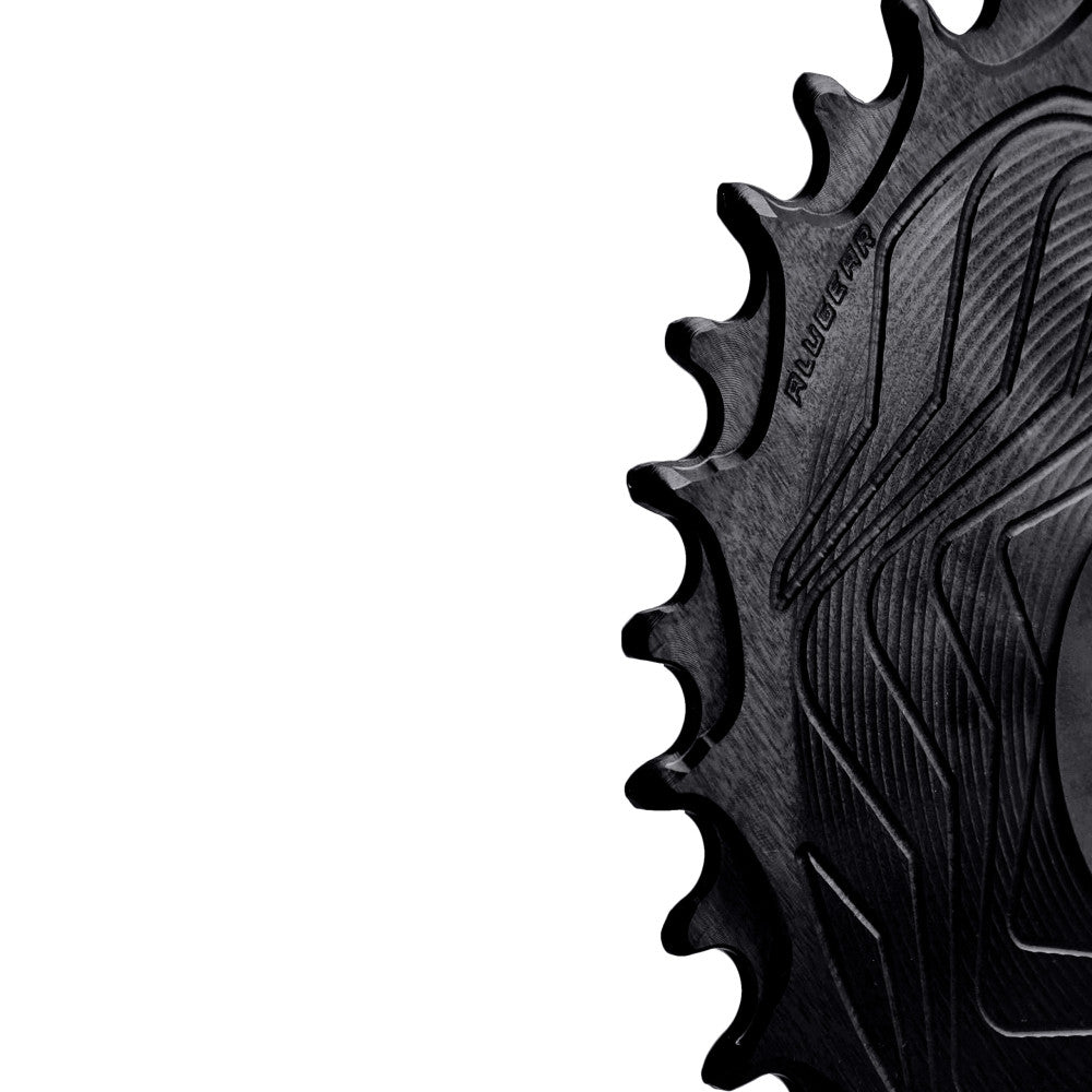 Black ALUGEAR round AERO MTB chainring close-up showing narrow-wide teeth and wave body, 104 BCD 4-bolt