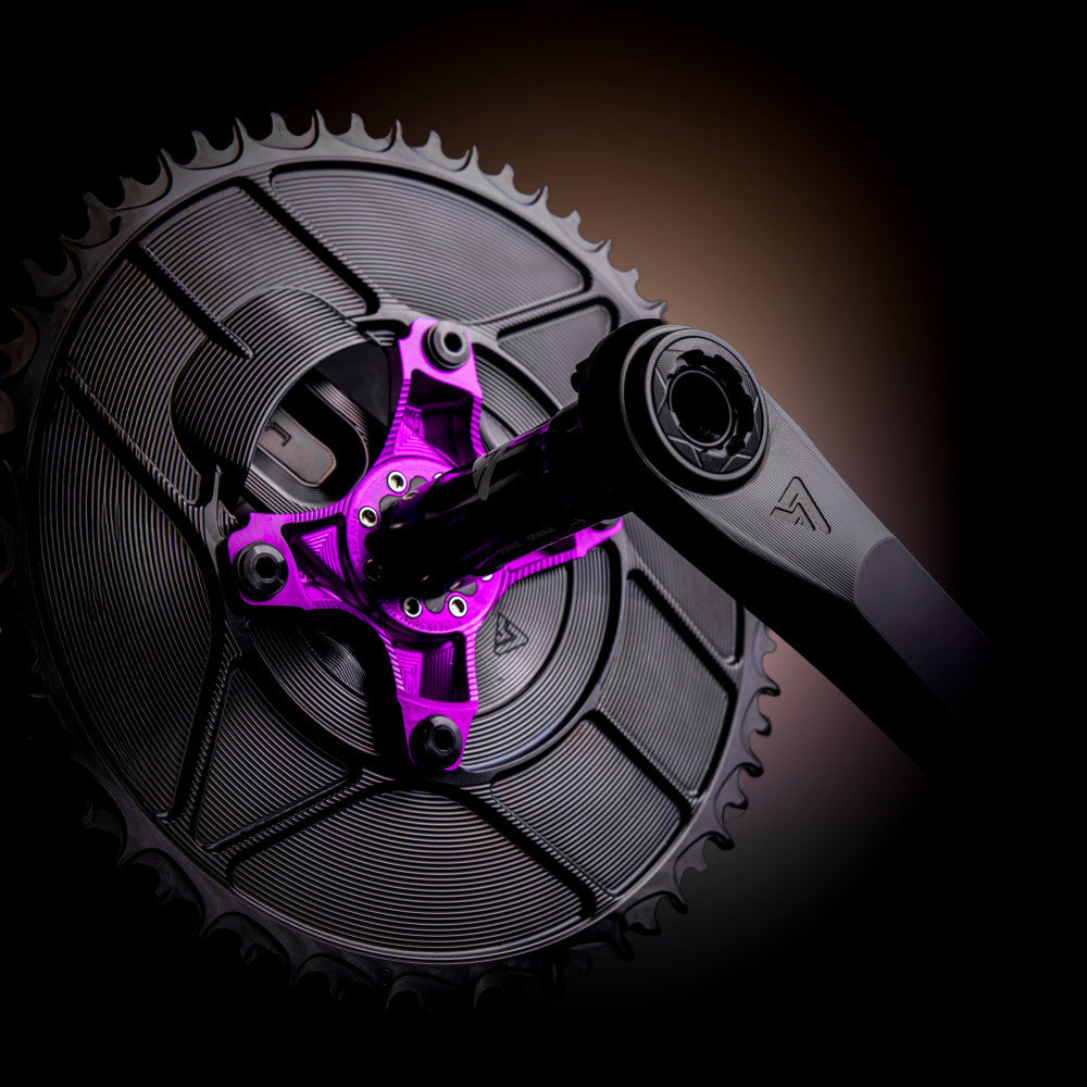 Purple anodized ALUGEAR crank spider on road cranks with 2X AERO chainrings, dark warm-light lifestyle