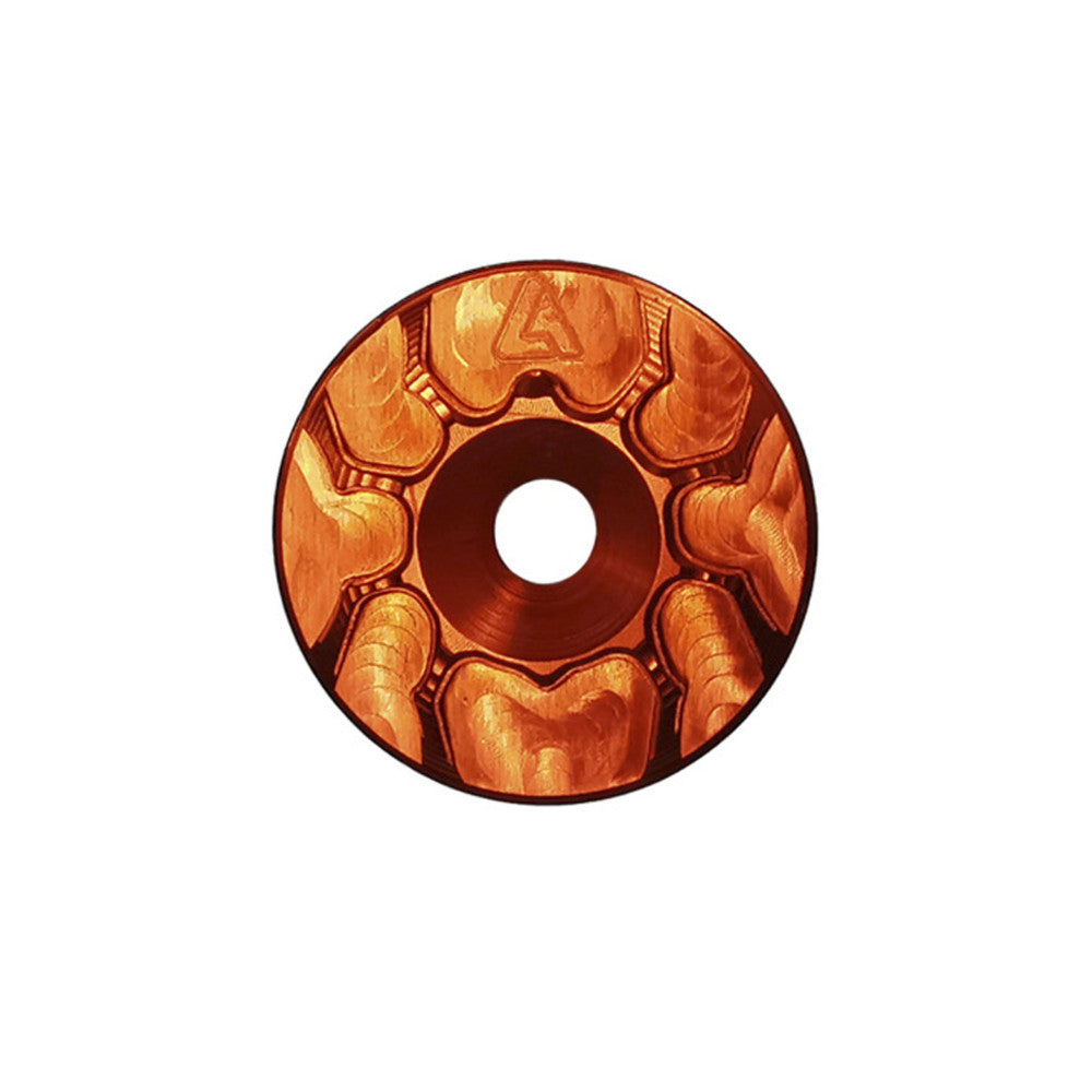 Orange anodized ALUGEAR headset top cap with spider cut-out design, front face view