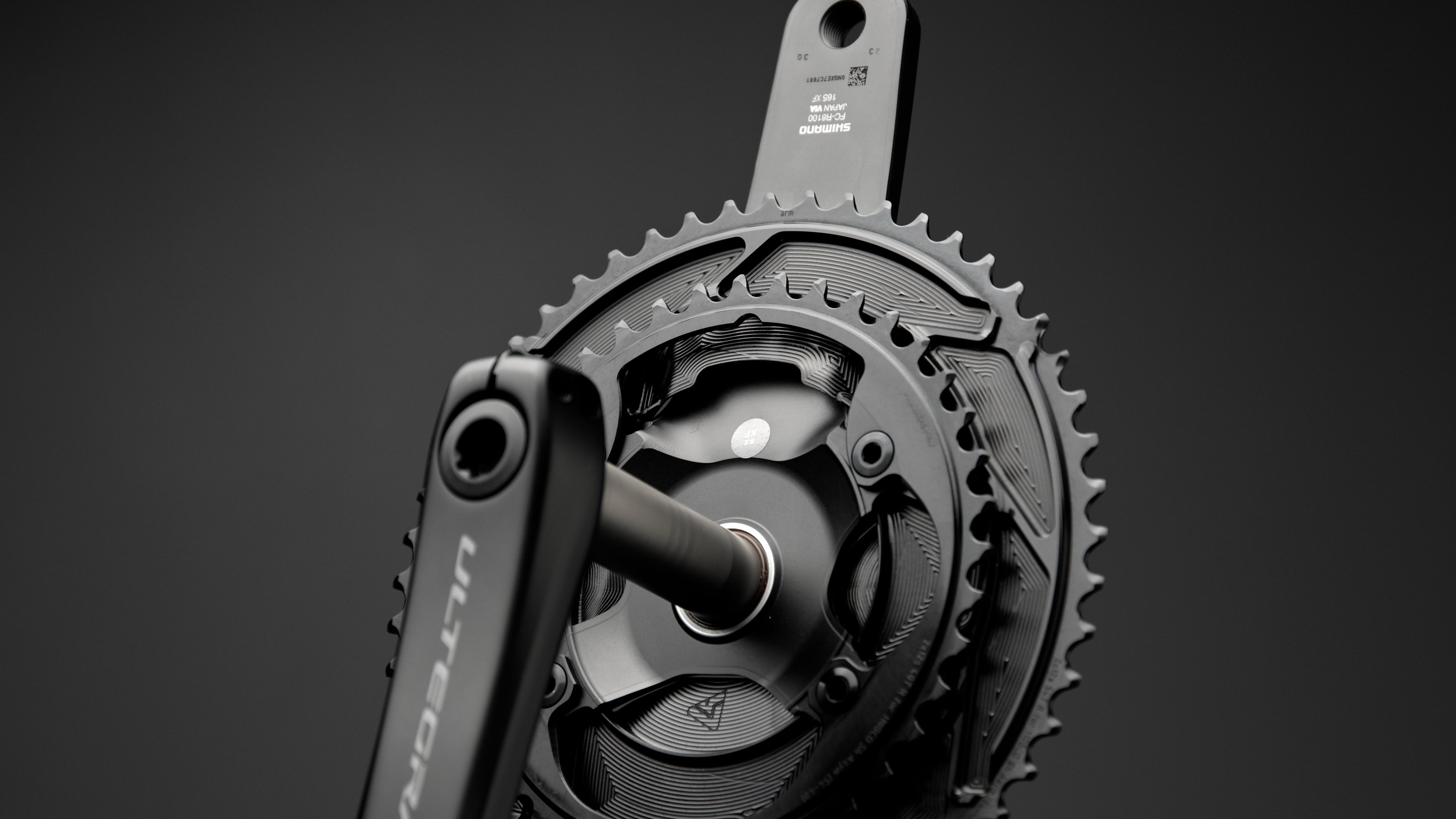 ALUGEAR AERO 2X chainring set with cover installed on Shimano Ultegra crankset, dark studio background
