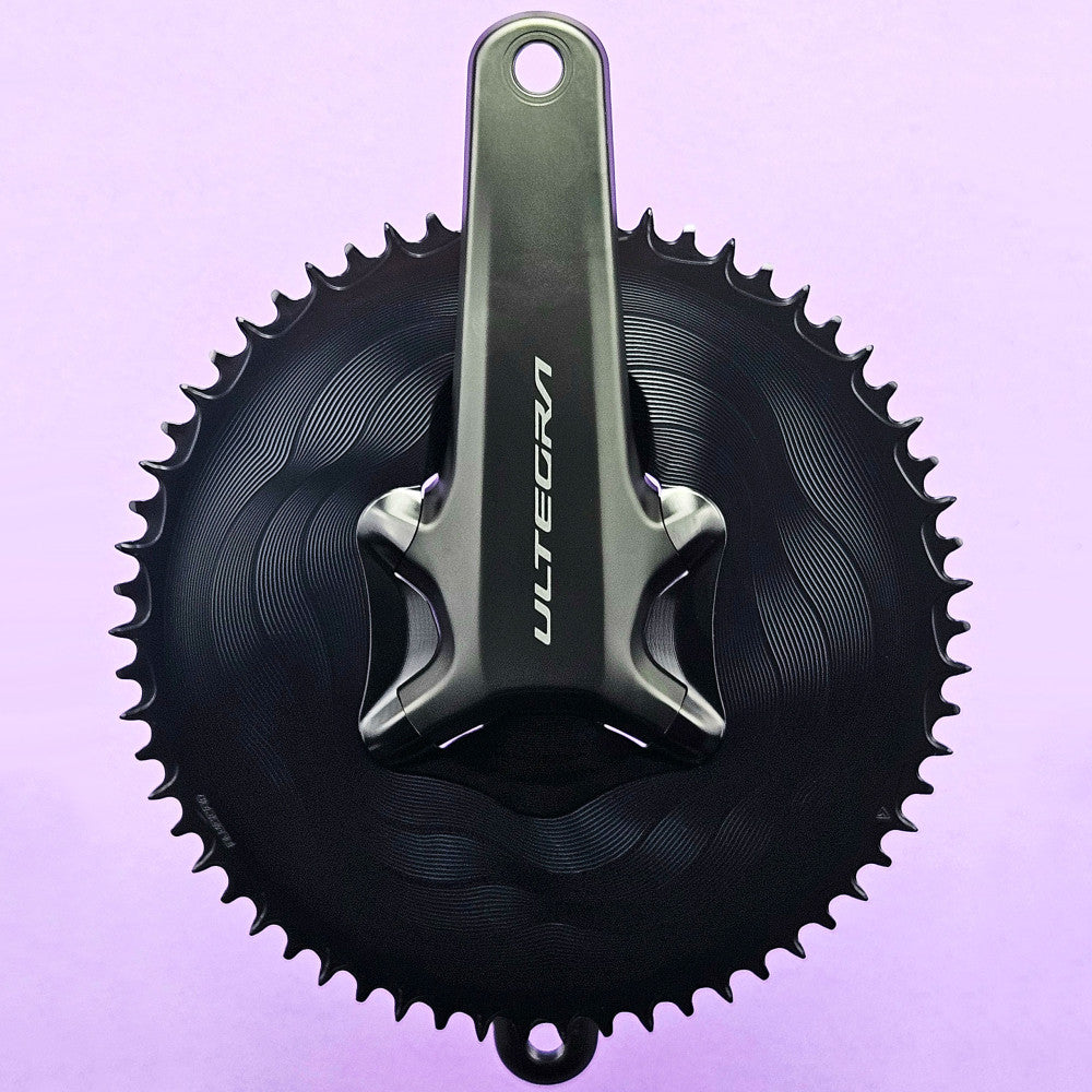 Black round ALUGEAR road chainring mounted on Shimano Ultegra crank, 110 BCD 4-bolt asymmetric, 1X 12-speed