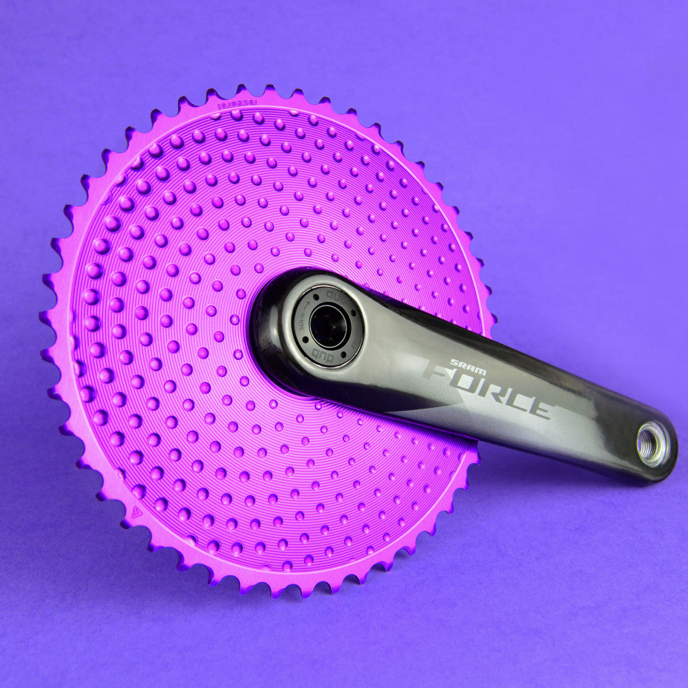 Purple anodized ALUGEAR round road chainring installed on SRAM Force crank on purple background