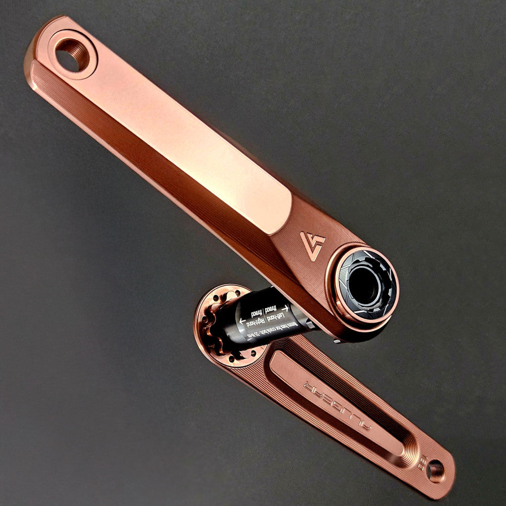 Rose copper anodized ALUGEAR Vega AL road gravel crankset assembly, DUB spindle, milled slot arms, dark background