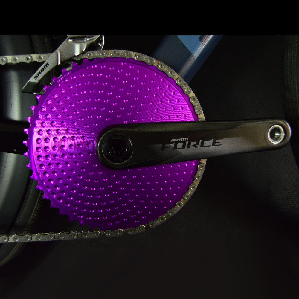 Close-up from chain side of purple ALUGEAR round road chainring on SRAM Force crank with SRAM front derailleur
