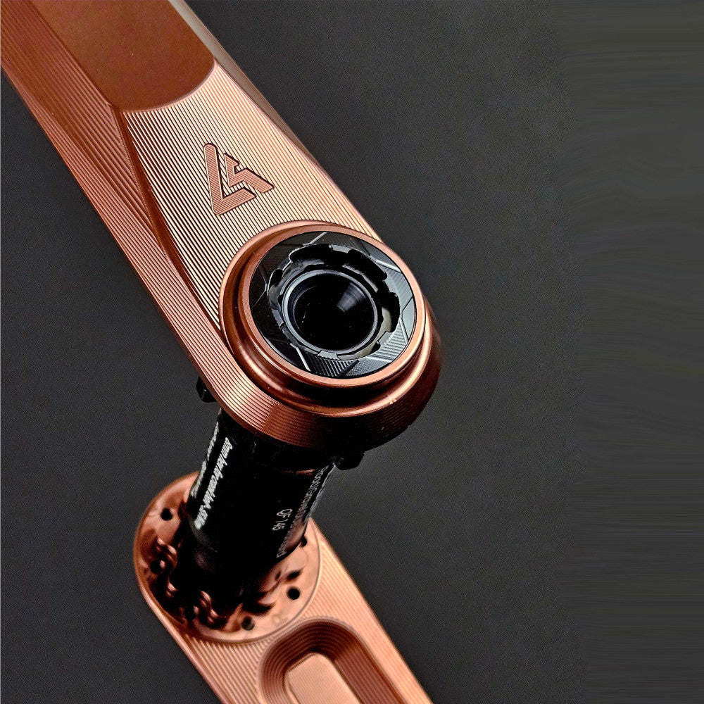 Rose copper anodized ALUGEAR Vega AL crank arm close-up, DUB bottom bracket spindle interface detail, dark background