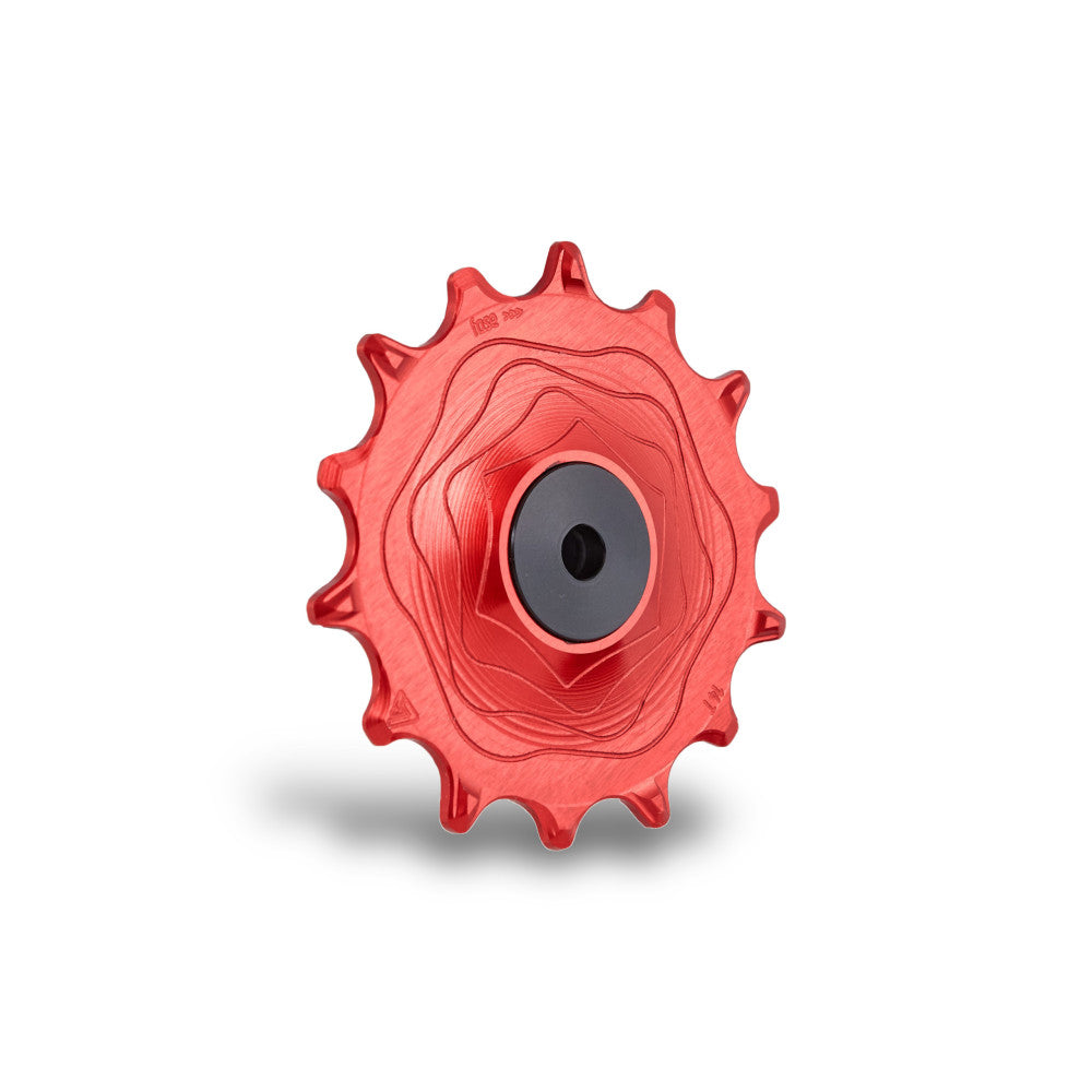 Single red anodized ALUGEAR AERO MTB rear derailleur pulley, SRAM 11/12-speed, wave-machined face, angled view