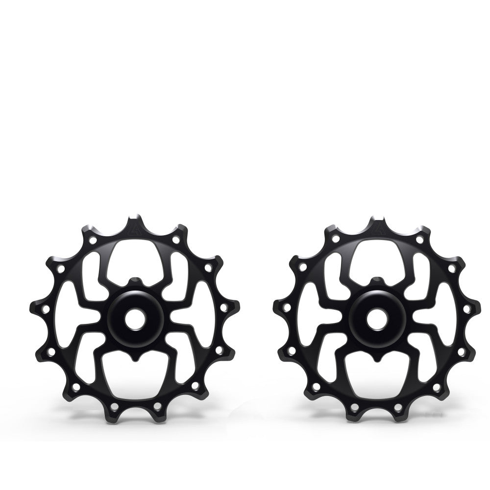 Pair of black anodized ALUGEAR Spider-style MTB rear derailleur pulleys, 13T+13T, Shimano 12-speed, flat lay