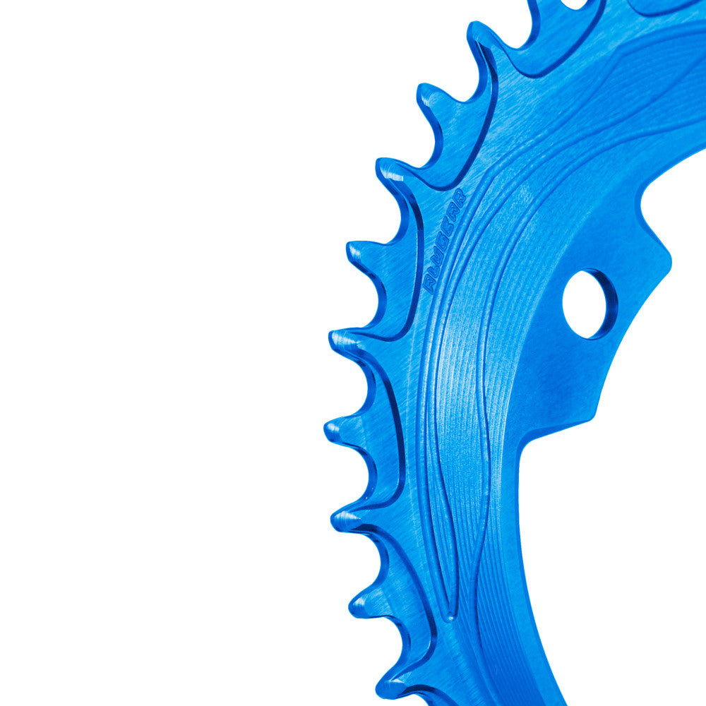Blue anodized ALUGEAR 94/96 BCD 4-bolt MTB chainring, macro close-up of narrow-wide teeth with flow-line machining