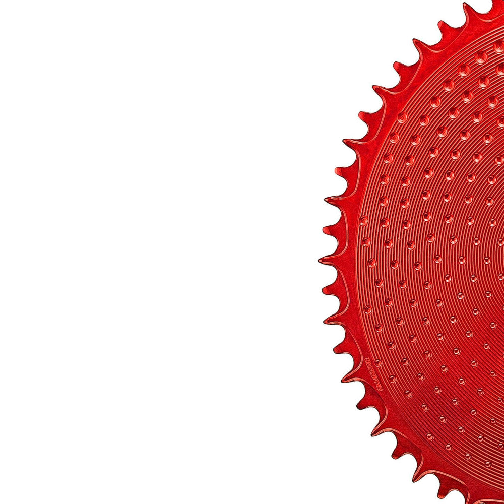 Red anodized ALUGEAR round AERO road/gravel 1X chainring, thread mount 6.5mm offset, dot texture surface, partial view