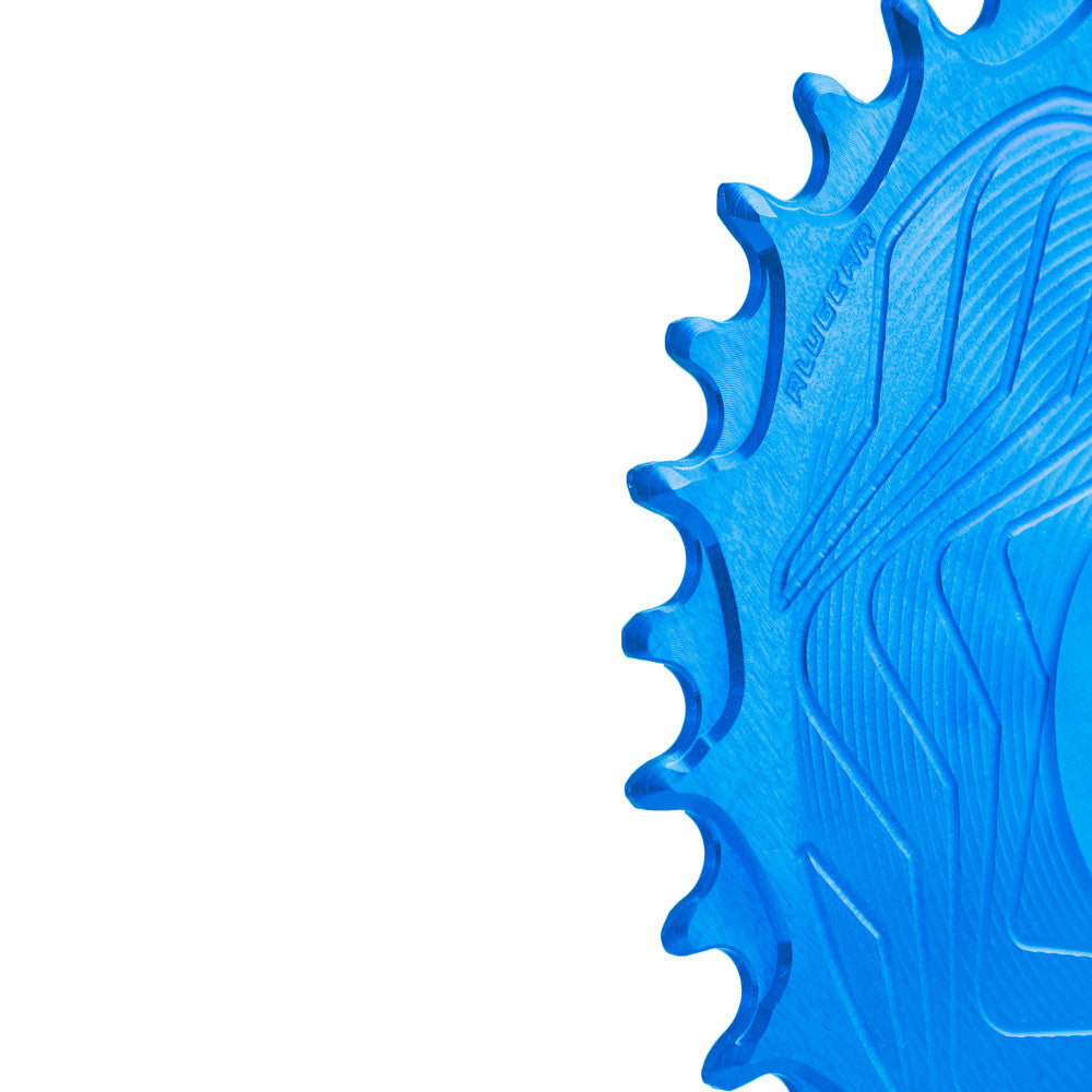 Blue anodized ALUGEAR Boost AERO MTB chainring close-up showing narrow-wide teeth and wave body, SRAM 3-bolt direct-mount