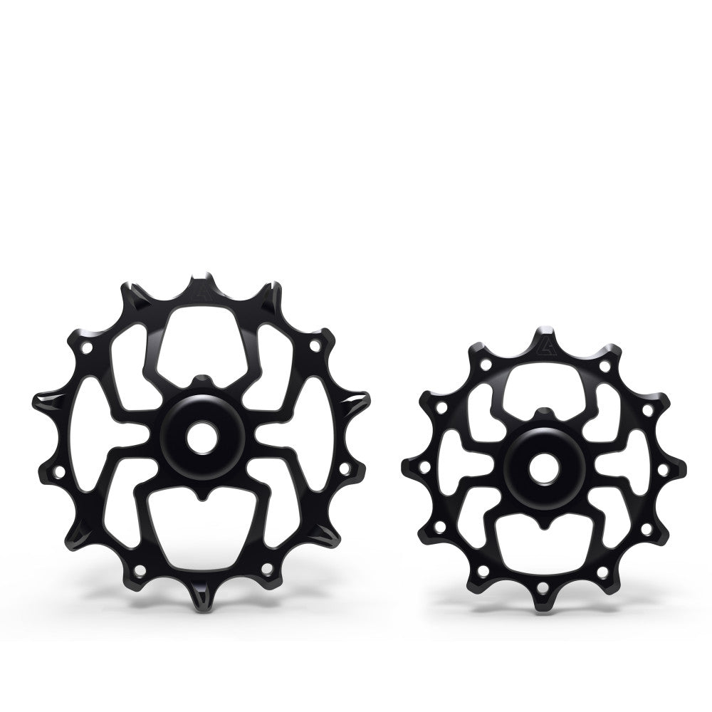 Pair of black anodized ALUGEAR Spider-style MTB rear derailleur pulleys, different sizes side by side