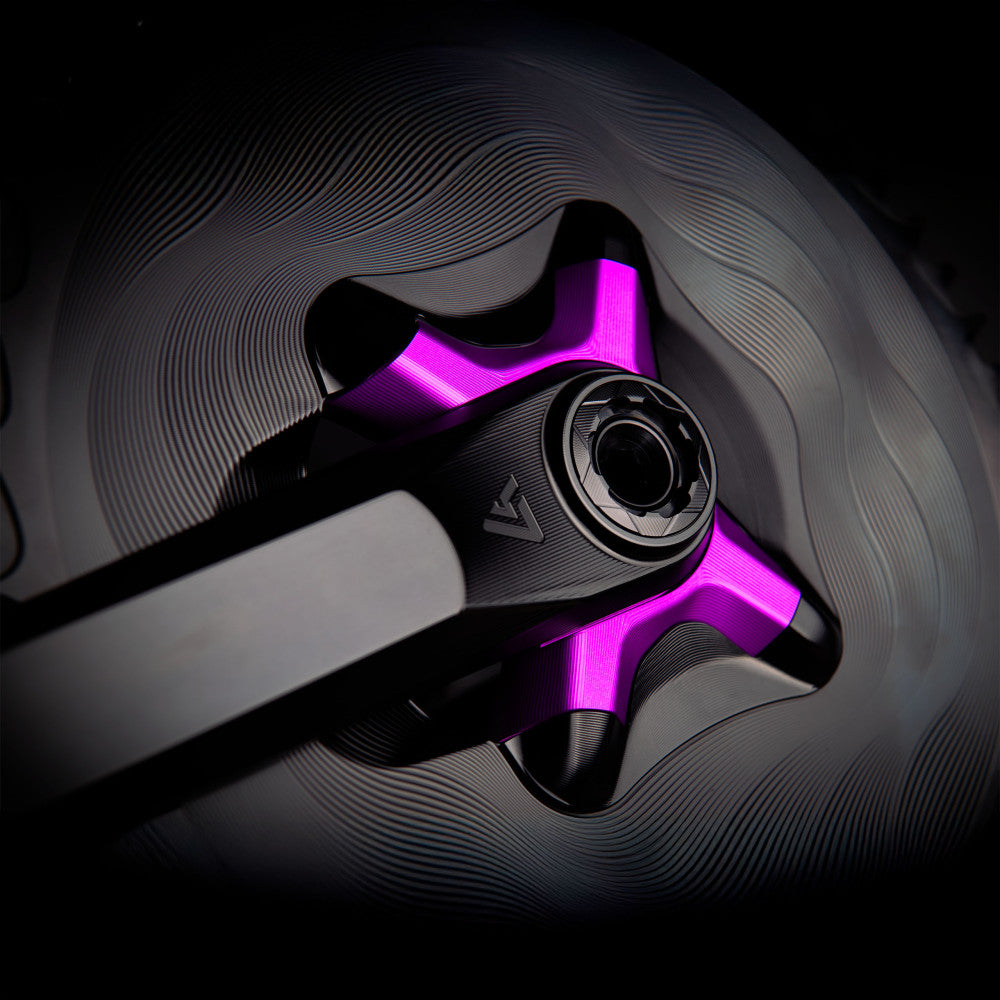 Purple anodized ALUGEAR 4-arm crank spider detail, spindle interface and crank arm close-up