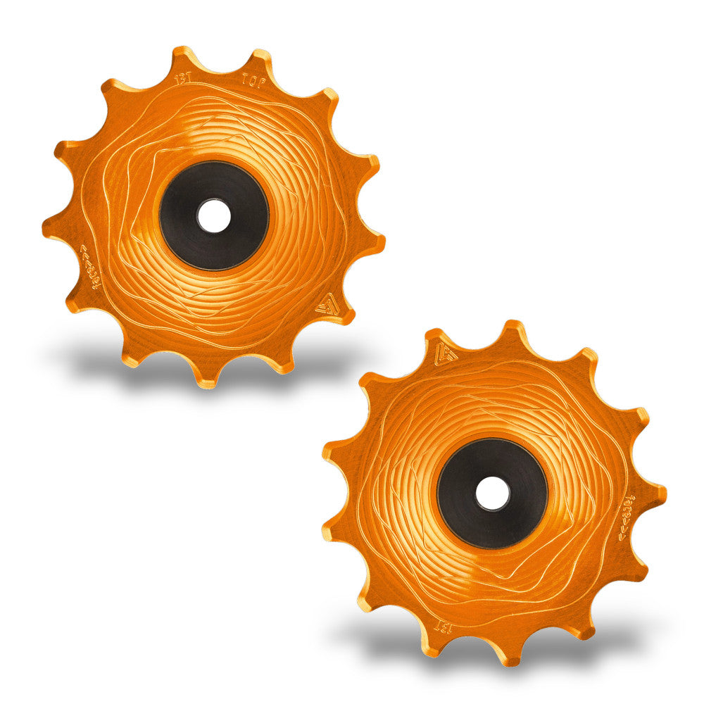 Para pomarańczowych anodowanych rolek tylnej przerzutki AERO MTB ALUGEAR, 13T+13T, Shimano 12-rzędowy, lico z falistym frezowaniem