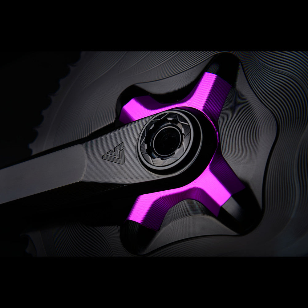 Purple anodized ALUGEAR 4-arm crank spider extreme close-up showing arm texture and spindle bolt, dark background