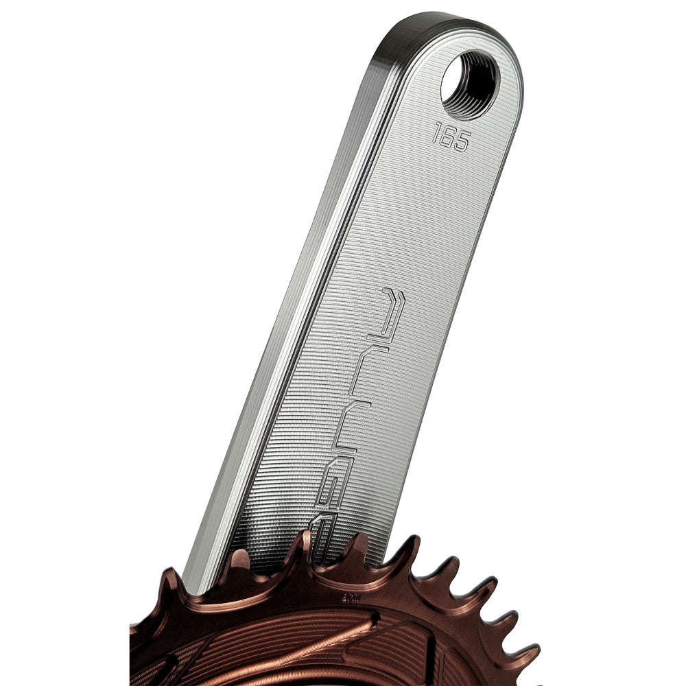 Close-up of titanium ALUGEAR Stellar Ti crank arm tip showing 165mm marking and copper chainring